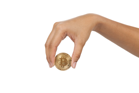 close up of hand holding bitcoin on white backgroundの写真素材