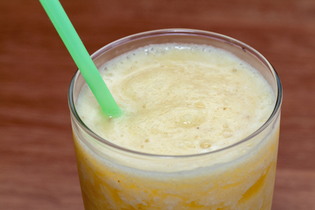 close up of pineapple smoothie on glassの写真素材