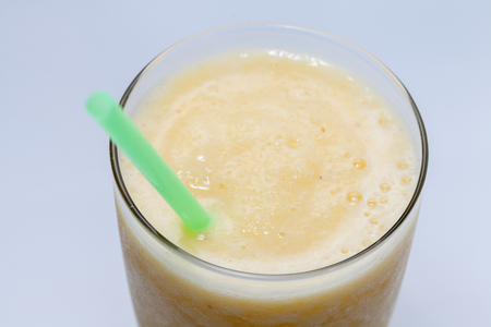 close up of pineapple smoothie on glassの写真素材