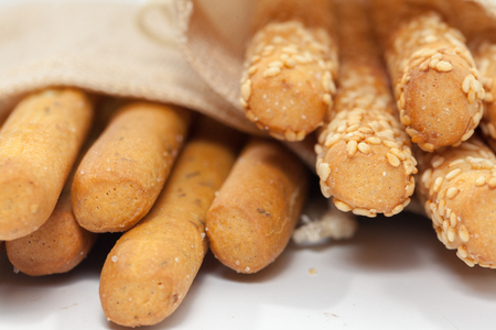 close up of bread stick on sack