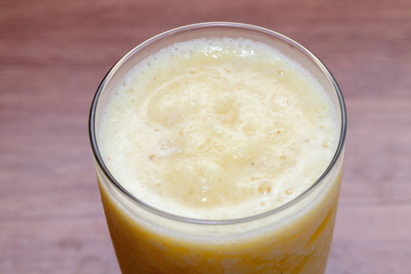 close up of pineapple smoothie on glassの写真素材