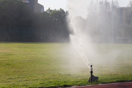 water springer on football field at thailandの写真素材