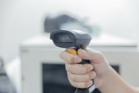 close up of Hand with bar code scannerの写真素材