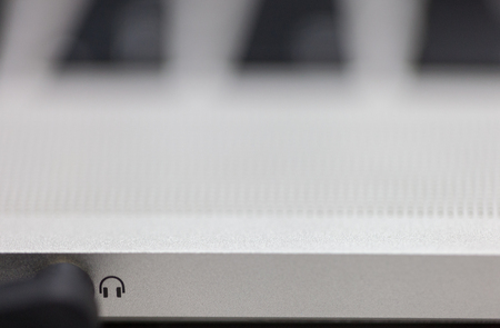 Plug in the headphones on the laptopの写真素材