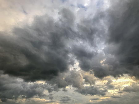 dramatic dark grey clouds before storm backgroundの写真素材