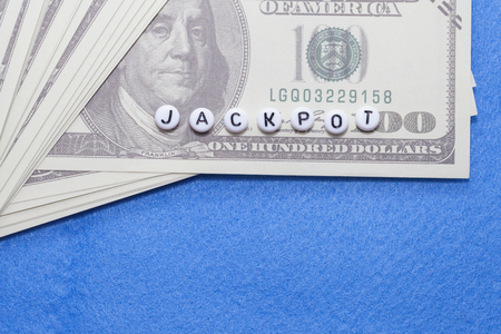 word jackpot with money, online gambling concept