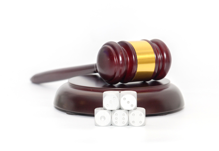 Judge Gavel with dice on white backgroundの写真素材