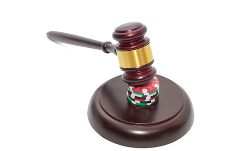 Judge Gavel with poker chips on white backgroundの写真素材