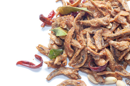 Crispy deep fried small fish on white backgroundの写真素材