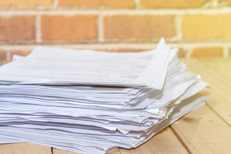 Business Concept, Pile of unfinished documents on office deskの写真素材