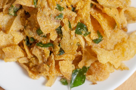 close up of salted egg potato chips on plateの写真素材