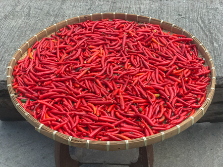 close up of red chilli on bamboo trayの写真素材