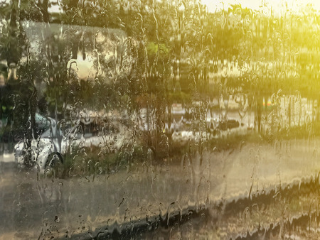 Rain Drop on glass windows with fast moving trainの写真素材