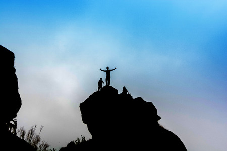 silhouette of tourist group on high cliff rock in mon jong doi at Chaing mai, Thailand