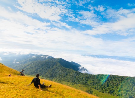 group of tourist sitting on the top of mountain at Doi Mon Jong, Chiang Mai, Thailandの写真素材