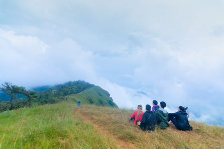 group of tourist sitting on the top of mountain at Doi Mon Jong, Chiang Mai, Thailandの写真素材