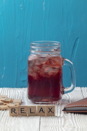 close up of iced pomegranate juice in glass on the tableの写真素材