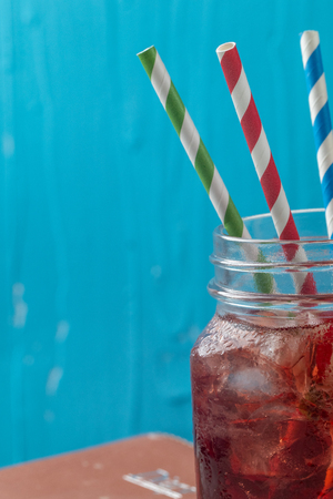 close up of iced pomegranate juice in glass on the tableの写真素材