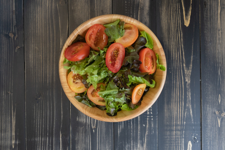 flat lay vegetable salad on bowl and breadの写真素材