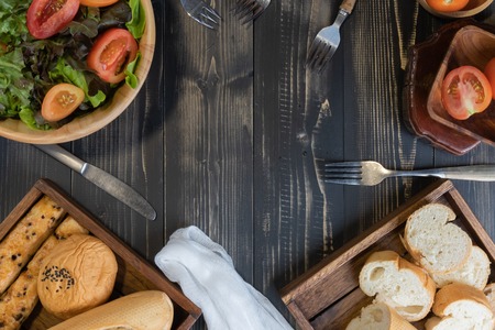 flat lay vegetable salad on bowl and breadの写真素材