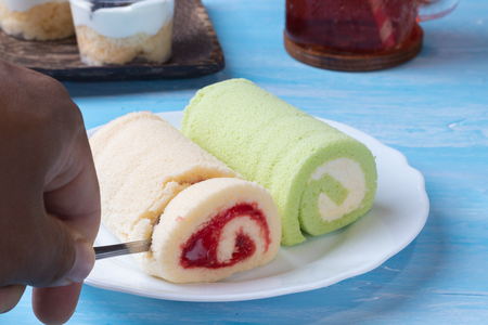 pandan swiss roll cake and strawberry swiss roll cakeの写真素材