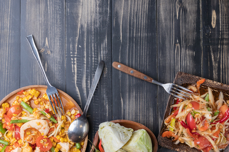 corn and papaya salad on wooden plate Thai styleの写真素材