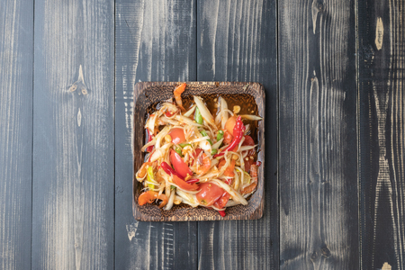 close up of papaya salad on wooden plate Thai styleの写真素材