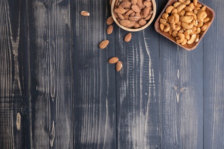 almond and Cashew nut on wooden bowlの写真素材