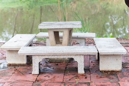 outdoor marble table set near pond at Thailand