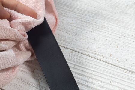 black leather belt and mink oil for care leather product