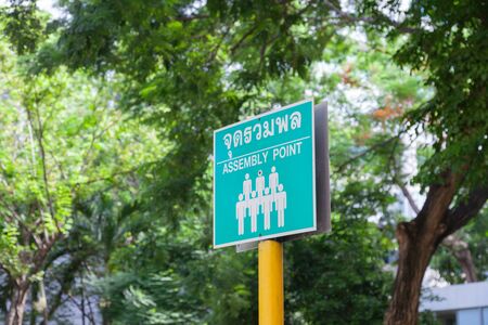 emergency green assembly point sign translate in Thaiの写真素材