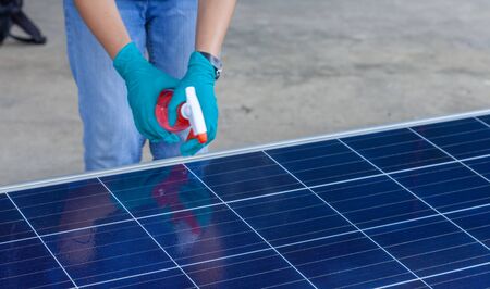 scientist spraying nano coating on Solar panel