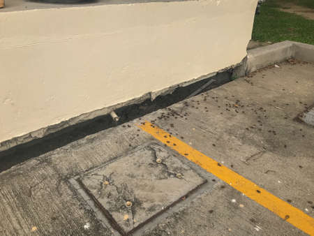 close up of Land subsidence gap between hole and buildingの写真素材