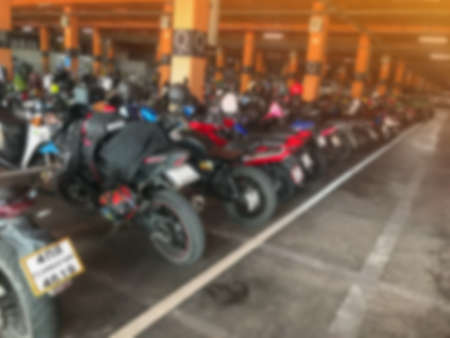 blurry of indoor motocycle parking lot background