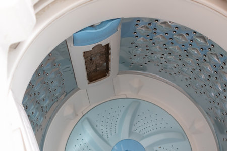 close up of Cleaning The Debris Filter dirty and rusty washing machineの写真素材