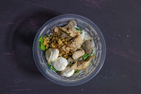 Steamed noodles without soup in plastic bowl. fast deliveryの写真素材