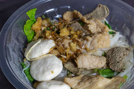 Steamed noodles without soup in plastic bowl. fast delivery