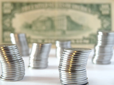 Coins on ten dollar backgroundの写真素材