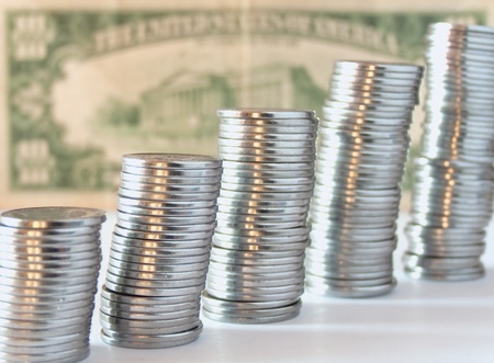 Coins on ten dollar backgroundの写真素材