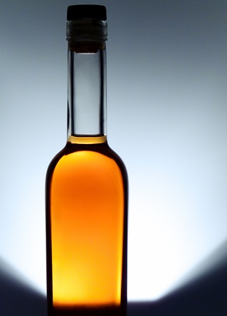 Bottle of cognac on gray backgroundの写真素材