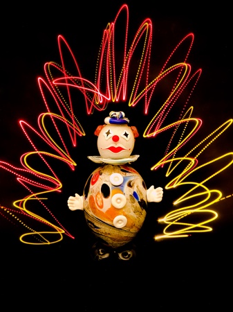 glass clown on black background with light lineのeditorial素材