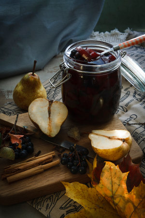 Autumn preservs from pears and aronia, home made jams concept.の写真素材