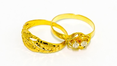A pair of gold wedding rings isolated on white background