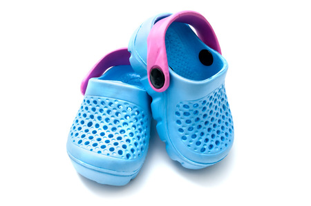 Blue baby shoes isolated on white background
