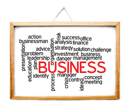 Business and related words on whiteboard isolated on whiteの写真素材