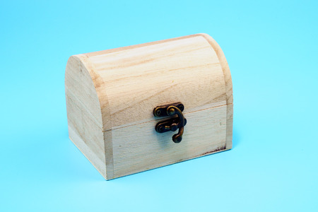 Wooden old chest on blue background