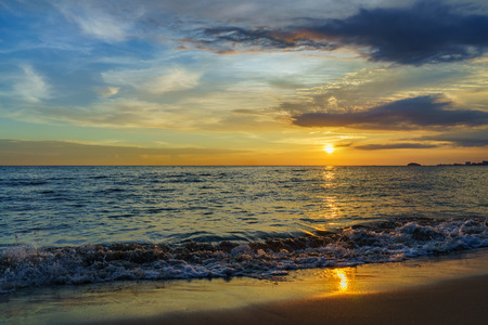 Beautiful majestic sunset by the beachの写真素材