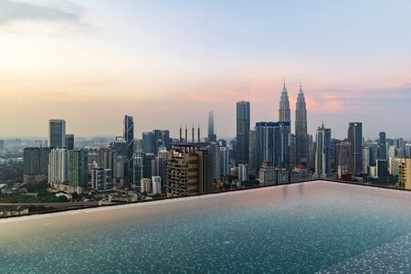 KUALA LUMPUR, MALAYSIA - MAY 20,2019 : Beautiful morning view of Kuala Lumpur city skyline from the roof top infinity poolのeditorial素材