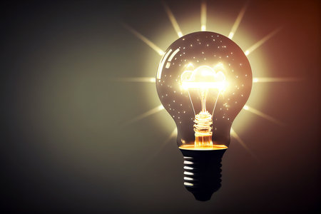 Glowing light bulb with cloud and sun on dark background.の素材
