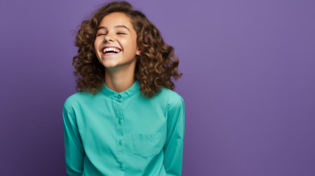 Lively purple ensemble on grinning teen with turquoise backの素材
